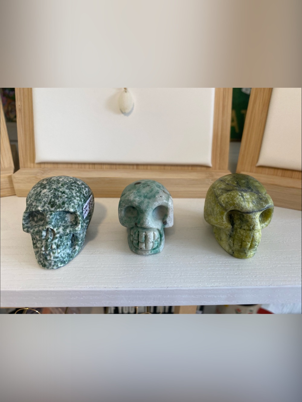 Three Decorative Stone Skull Figurines - Green & Yellow Tones